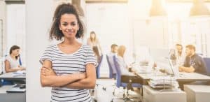 New answering service business owner in front of office